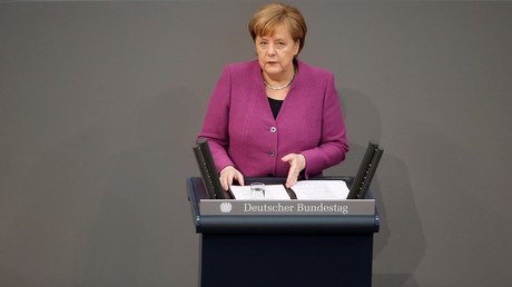 Merkel walks out of parliament after AfD leader lambasts her support for migrant quota system