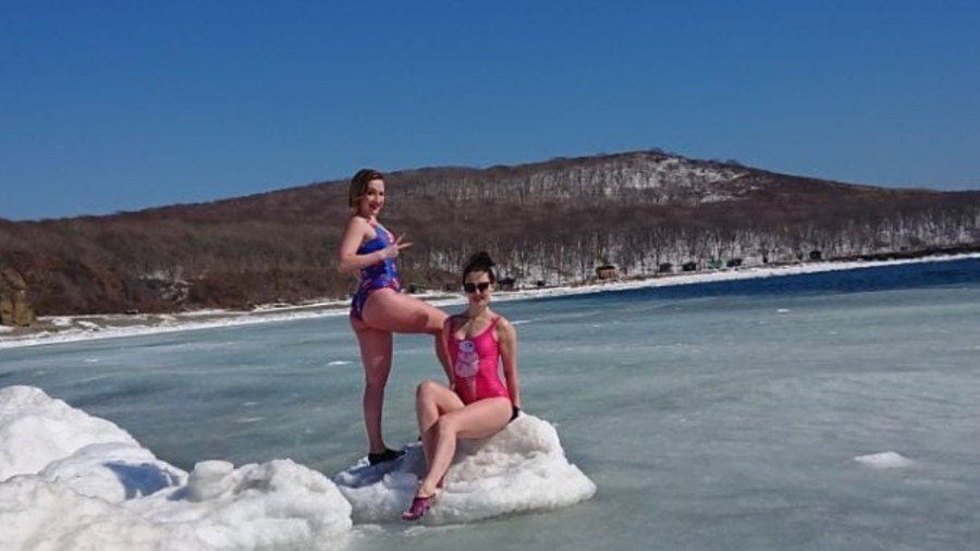 Bikini-clad Russian women brave icy waters in Far East (PHOTOS, VIDEO) 