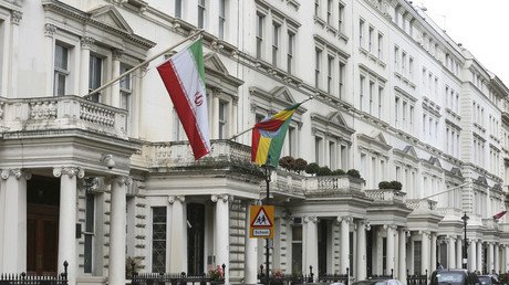 Men clad in black climb onto Iran’s embassy in London, take down flag