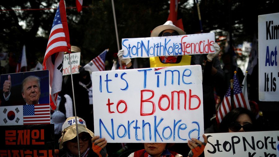 'Bomb North Korea' protest as leaders seek to defuse months of tension