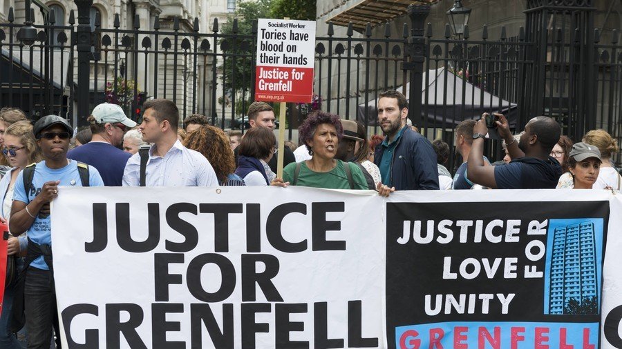 ‘Human-sized sock puppet’: Awkward picture of Theresa May posing with Grenfell artist stirs backlash