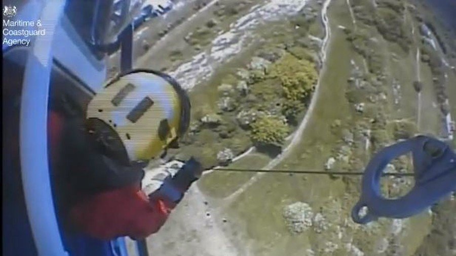 ‘Only minutes to spare’: Teen clings to 300ft cliff face in heart-stopping rescue (VIDEO)