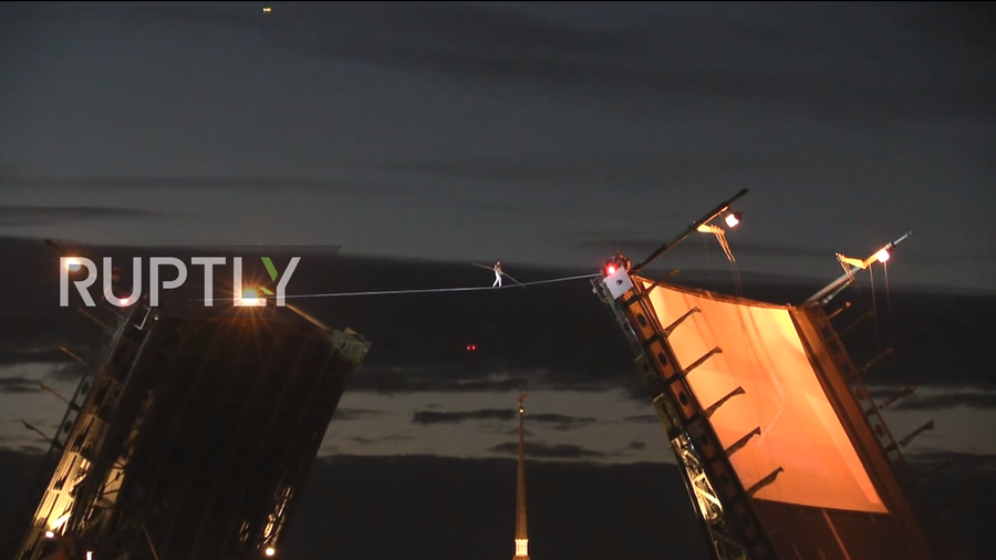 Russian tightrope walker stuns St. Petersburg as he crosses Neva River over open bridge (VIDEO)