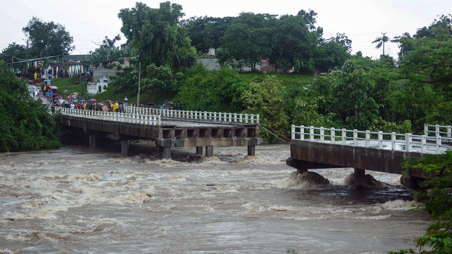 Cubans cheat death as bridge over floodwaters crumbles into raging rapids below (VIDEOS)