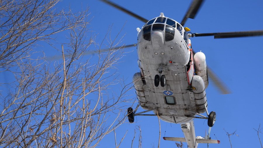 Chopper smashes into building during takeoff chaos in Siberia (VIDEO)