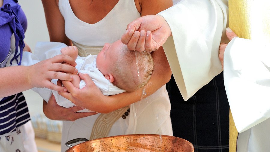Priest loses temper & slaps toddler during baptism (VIDEO)