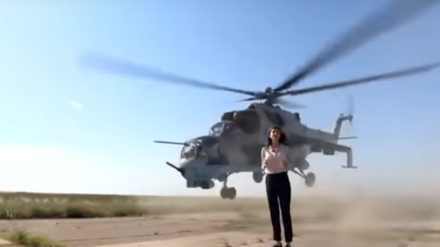 Hack avoids chop: Reporter risks decapitation when promoting army helicopters (VIDEO)