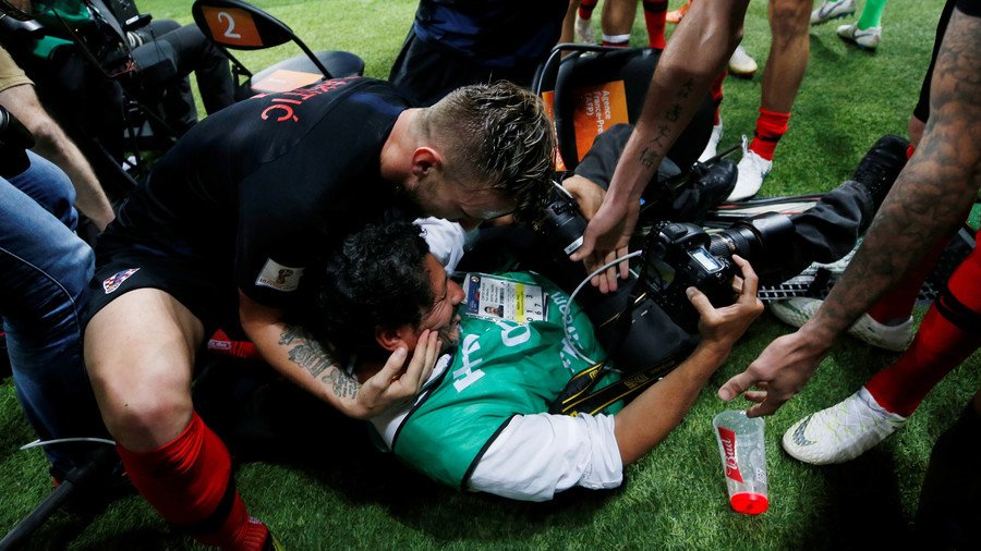 Croatian players send photographer sprawling amid wild World Cup winning goal celebrations