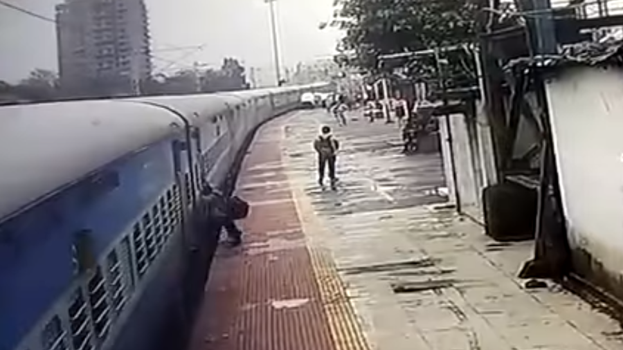 Passenger dragged by moving train in shocking CCTV footage (VIDEO)