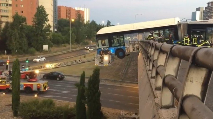 Bus left hanging off the edge of a bridge in Madrid crash (VIDEO)