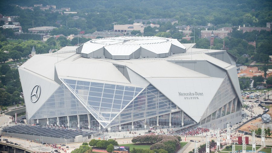 Rapper T.I. looks out from a suite during a tour of Mercedes-Benz Stadium,  the new stadium for the Atlanta Falcons NFL football team under  construction in Atlanta, Tuesday, April 25, 2017. (AP