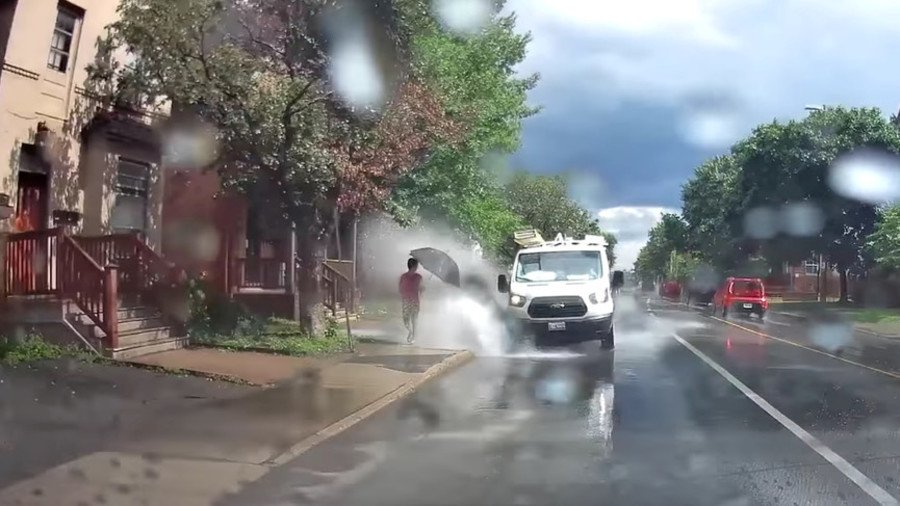 ‘Puddle villain’ van driver fired for targeting pedestrians in splashing rampage (VIDEO)