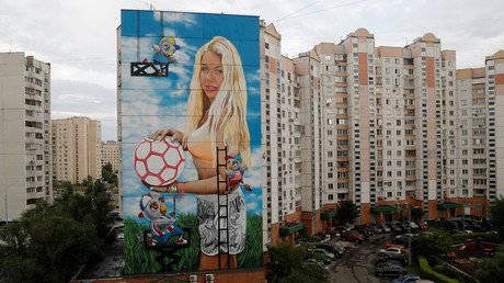 Russian businessman depicts his wife in 12-storey-high World Cup mural