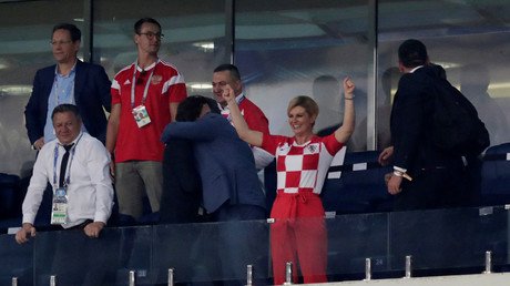 Croatia's president wins fans with show of VIP zone passion (but Russia's PM looks unimpressed)