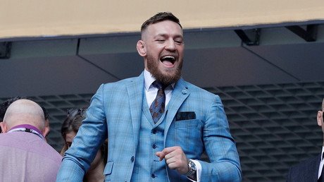 ‘Can I wrestle with it?’ Conor McGregor feeds and pets tiger in Russia after Putin meeting (VIDEO)