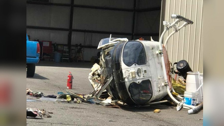 Police chopper crashes into parking lot after horrifying take-off malfunction (VIDEO)