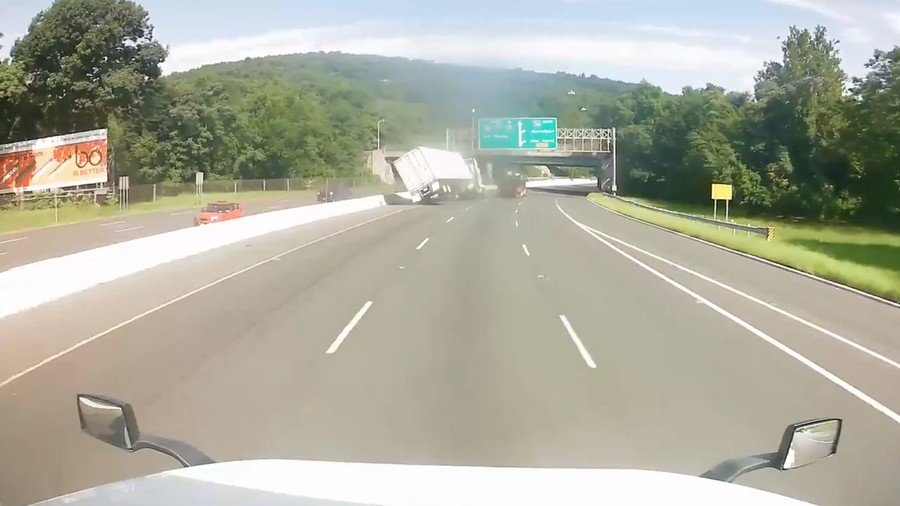 Candy crash: Bizarre motorist duel ends in shocking truck flip collision (VIDEO)