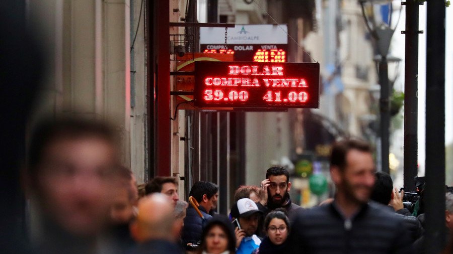 Argentina's currency collapses despite massive rate hike as possible debt default looms