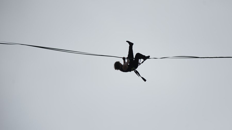 Nerve-racking: Tightrope walker thrills onlookers in St. Petersburg amid stormy winds