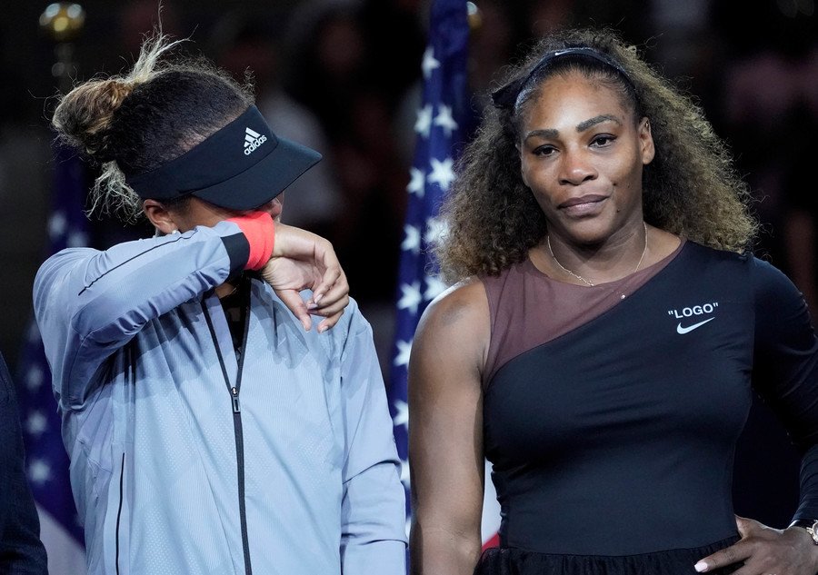 Naomi Osaka wipes away tears as Serena Williams looks on at the award ceremony after the US Open women's singles final / USA Today Sports