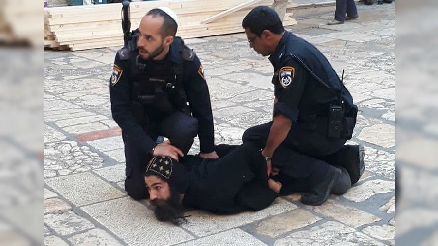 Israeli forces arrest monk & forcibly remove others protesting in East Jerusalem (VIDEO)