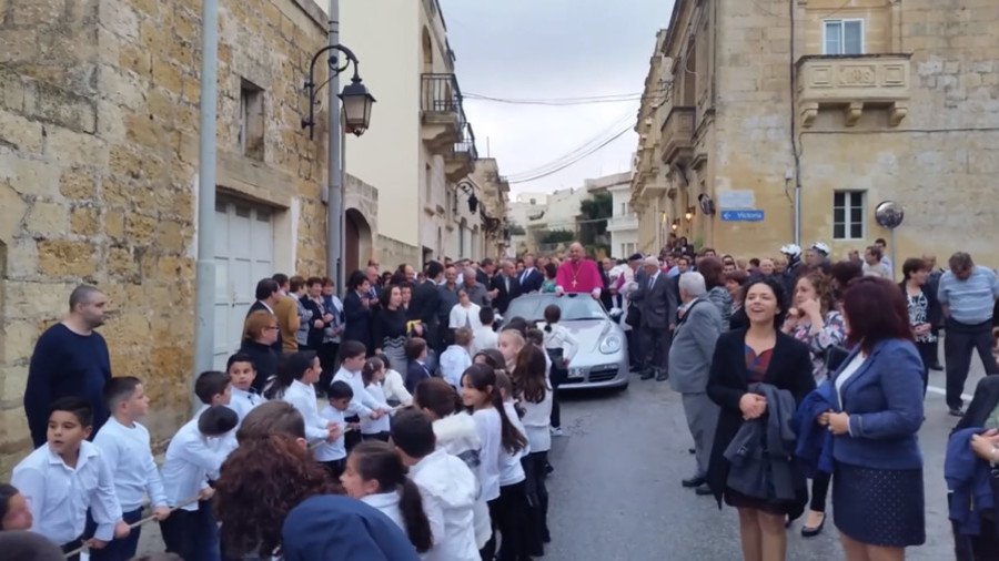 ‘Wrong on so many levels’: Priest paraded through town in Porsche pulled by children (VIDEO)