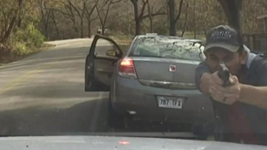 Gunman lays waste to police cruiser as officer miraculously survives shootout (VIDEO)