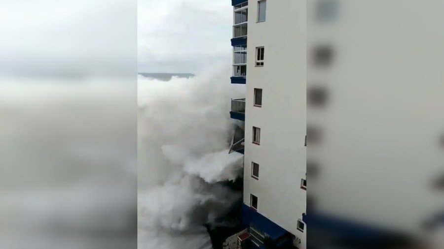 Monster wave wipes out balconies THREE stories up as storm rages in Tenerife (VIDEOS)