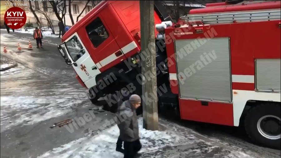 Oops! Fire engine rushing to emergency FALLS into sinkhole (VIDEO)