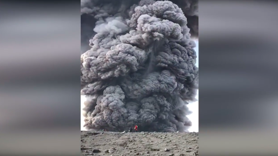 Brave or stupid? Russian hikers walk up volcano… as it erupts (VIDEO)