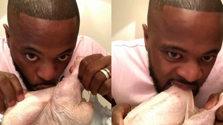 Finger lickin' good?: Former Manchester United defender Evra fondles raw turkey in bizarre video