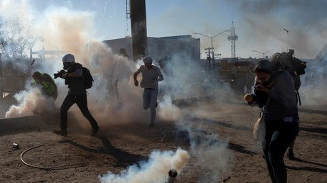 US border patrol repels migrants with tear gas after Mexico crossing closure