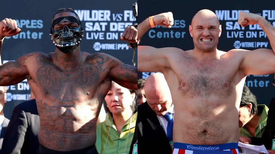 'His arse is flapping!' Tyson Fury says Deontay Wilder is rattled after raucous weigh-in (PHOTOS)