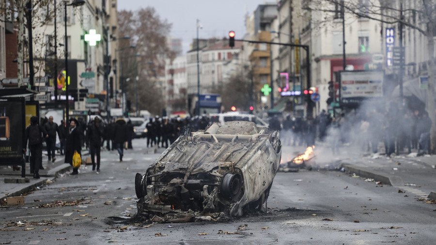 French students block high schools, burn cars and throw stones at police amid massive protests