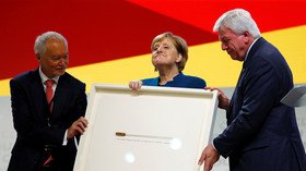 Twitter takes on Merkel over gift to mark end of her CDU party reign