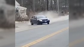 Shocking footage shows car smashing into parked truck after running over spike mat (VIDEO)