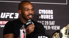 UFC champ Jon Jones charged with battery after 'placing waitress in chokehold at strip club'