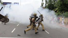 Police use tear gas at protest in India after women defy traditional ban on entering Hindu holy site