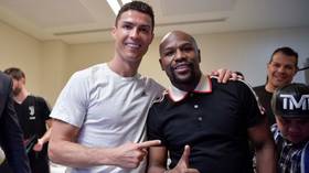 Floyd Mayweather celebrates with Cristiano Ronaldo as Juventus win Supercoppa Italiana