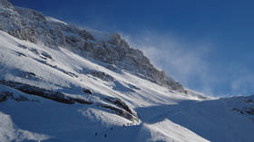 Up to 12 people buried in Swiss avalanche – reports