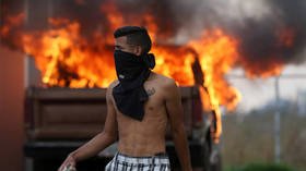 Venezuela crisis: Border clashes, ‘masked thugs’, ‘torched aid’ & fake Red Cross