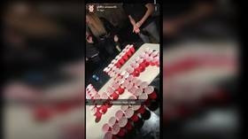 Outrage after California high school students salute Hitler and make swastika out of beer cups