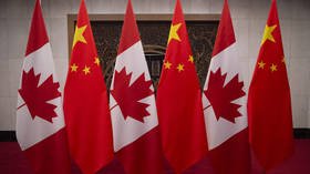 China confirms formal arrest of two Canadians after months-long detention