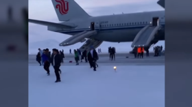 Panicked Los Angeles-bound passengers trudge through snow after emergency landing in Russia (VIDEO)