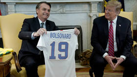 ‘Get me a printer, paper & glue!’ Trump mocked over ‘homemade’ jersey gift for Bolsonaro