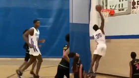 Incredibly tall 6th-grade basketball player DUNKS over his opposition (VIDEO)