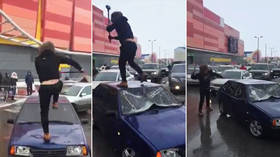 Horrific hammer attack on parked car causes outrage (VIDEO)