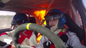 Rally drivers avoid tragedy, escape car as it bursts into flames mid-race (VIDEO)