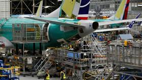 Boeing shares plunge over downgrade due to 737 Max production delays