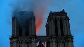 Fire threatens one of the rectangular towers on the front of Notre Dame